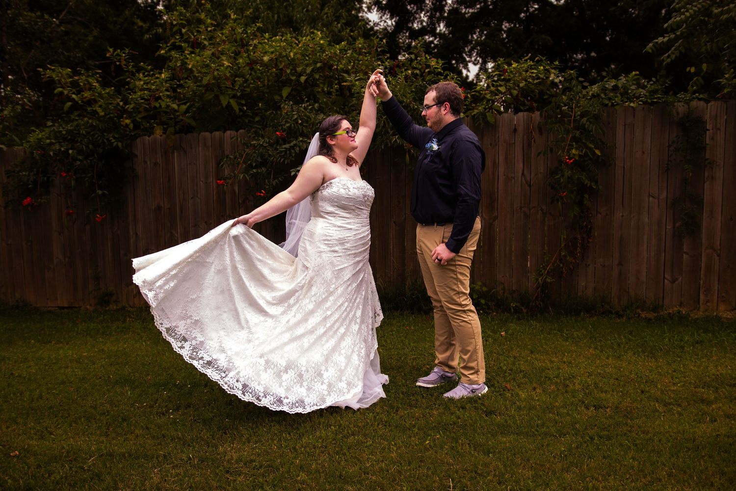 A series of seven romantic dance photos showing a couple twirling in a backyard with the bride's white dress flowing elegantly.