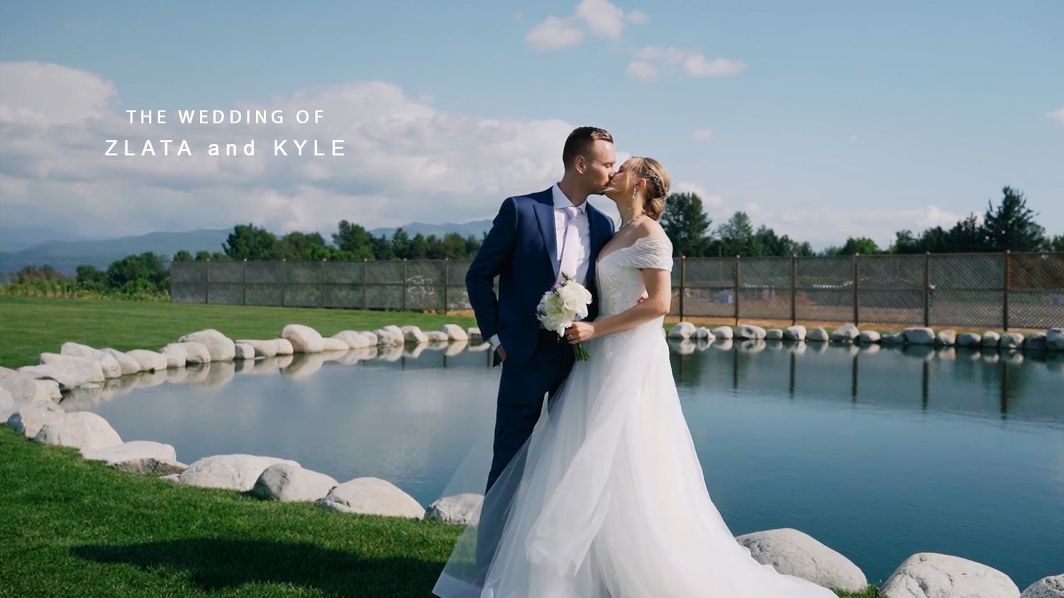 Scenic lakeside wedding photos with mountain views, white dress, and romantic poses by the water's edge at Maan Farms.