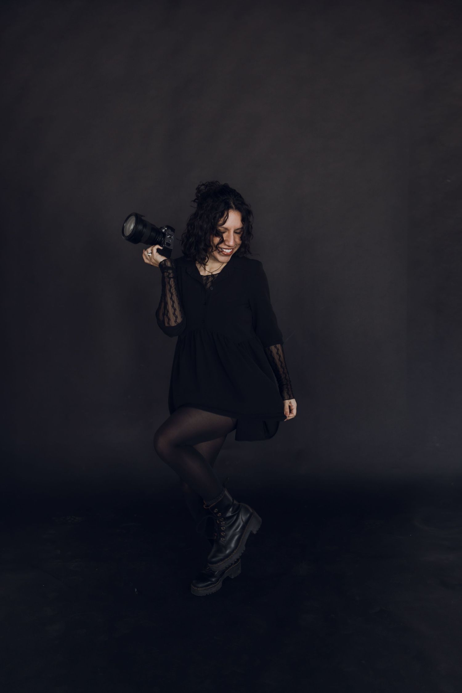 A dramatic dark portrait series showing a person in black clothing posing against a shadowy background.