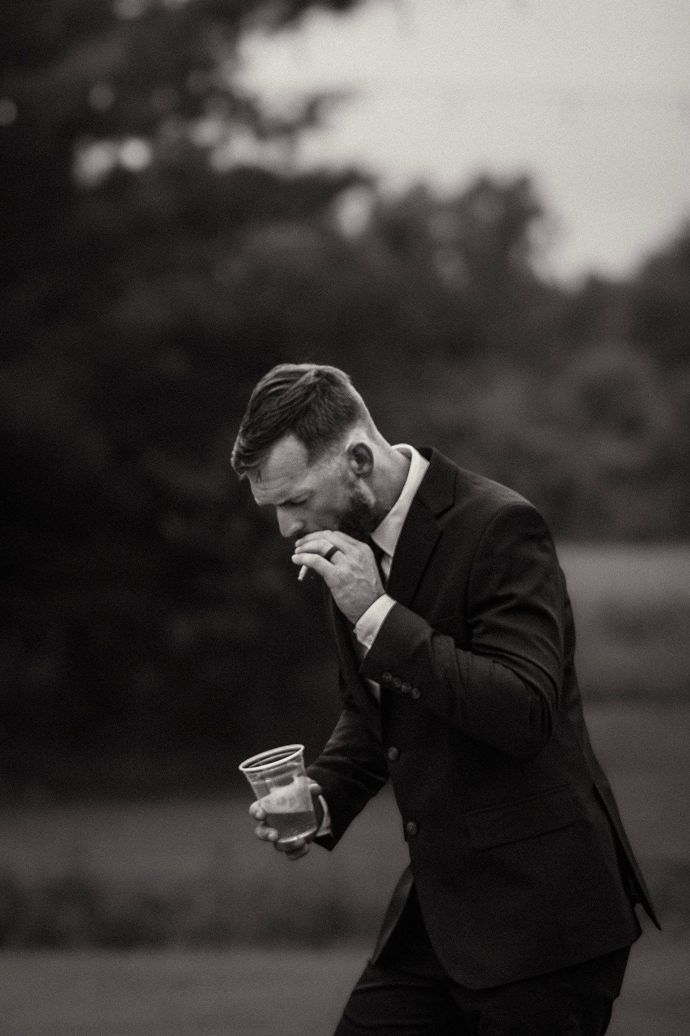Black and white sequence showing emotional reactions during a wedding first look moment.