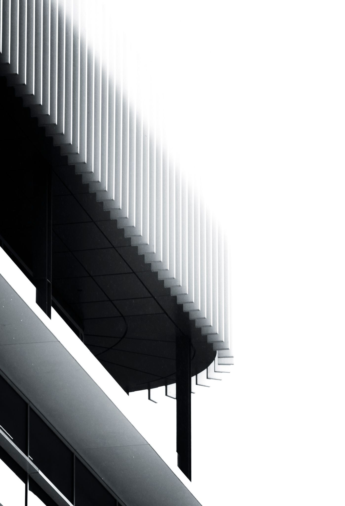 Black and white architectural detail of a modern building with geometric lines and vertical louvers against white sky.