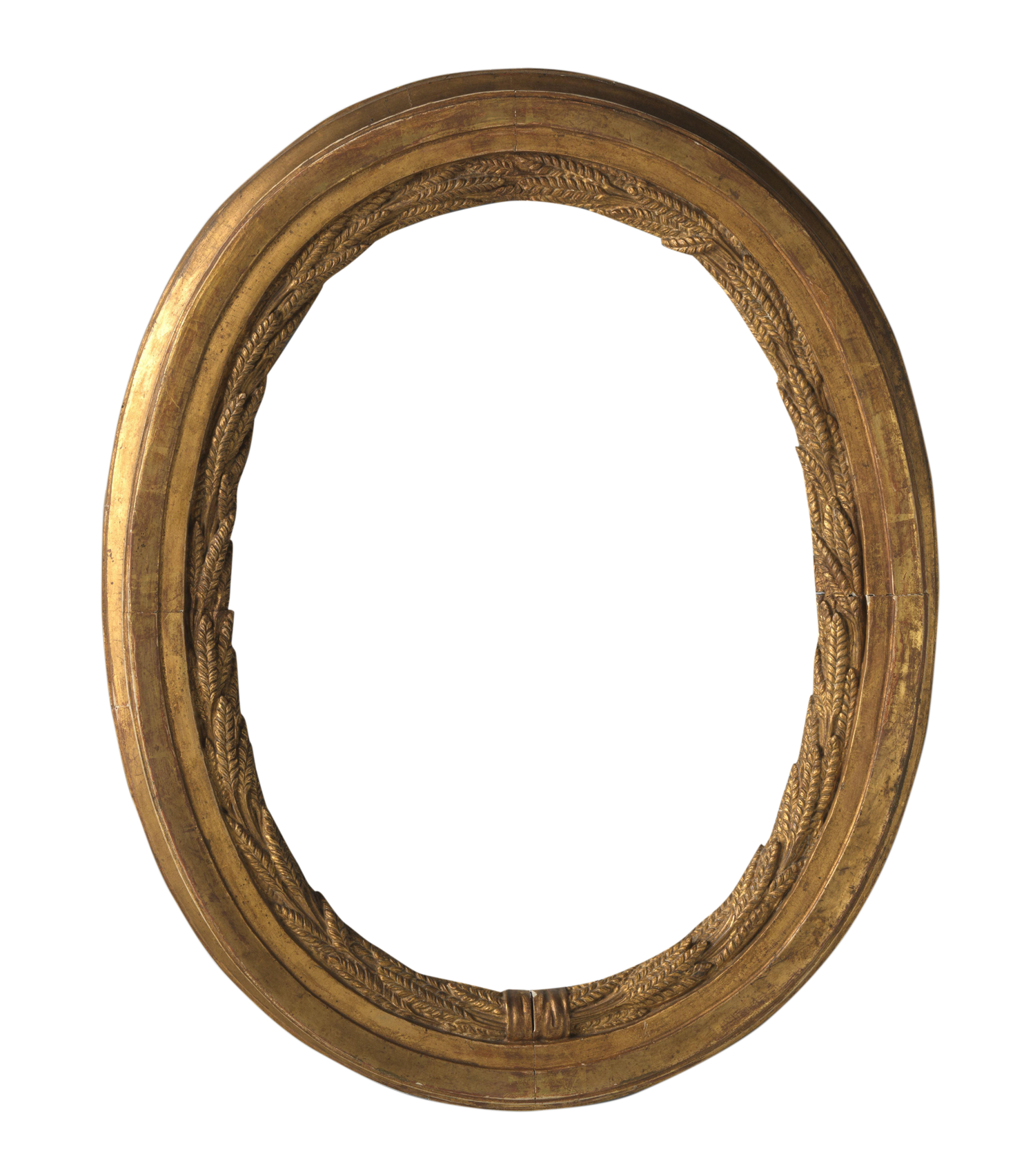 Ornate oval gold picture frame with intricate carved leaf details, antique gilded finish, isolated on white background.