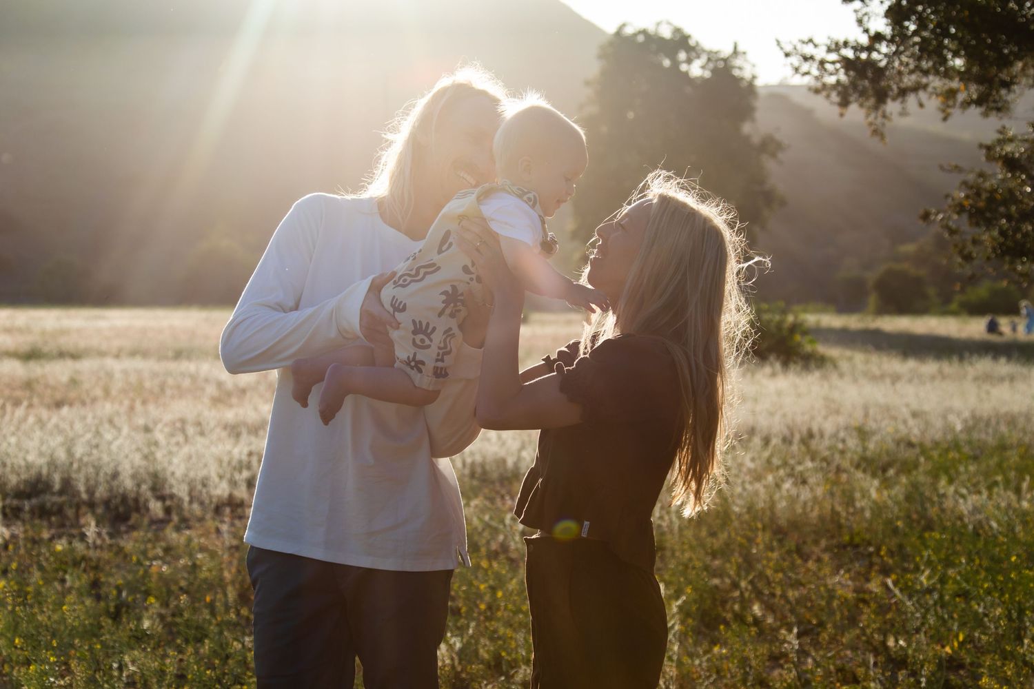 Sunset photography session with beautiful mountain backdrop and natural lighting.