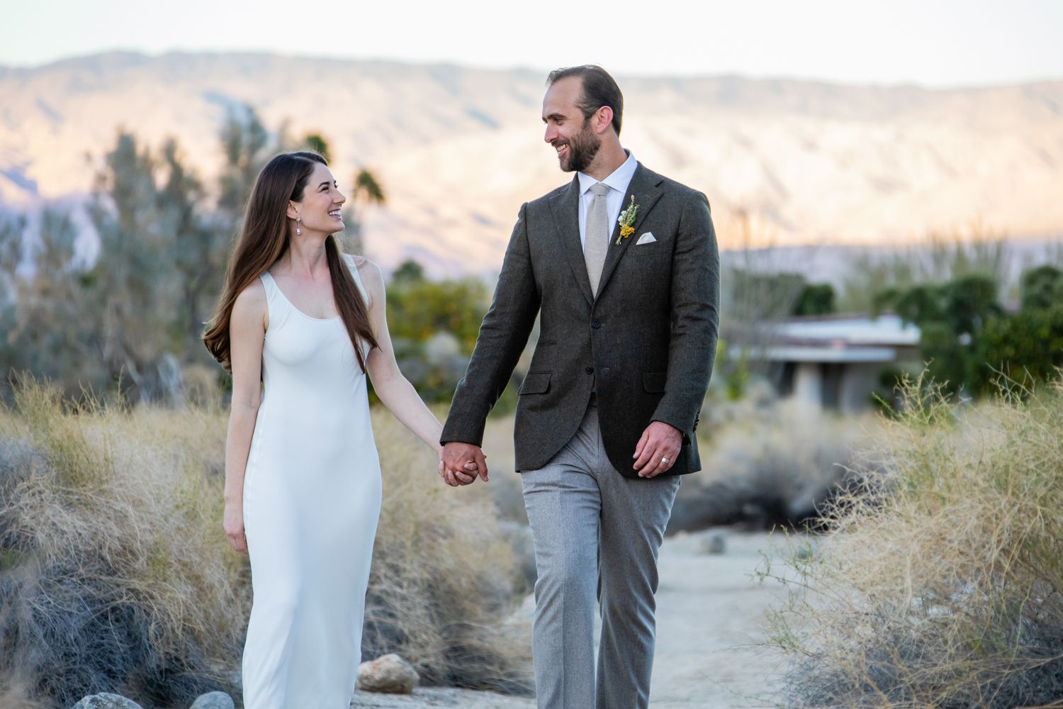 Elegant desert engagement photography session at sunset.