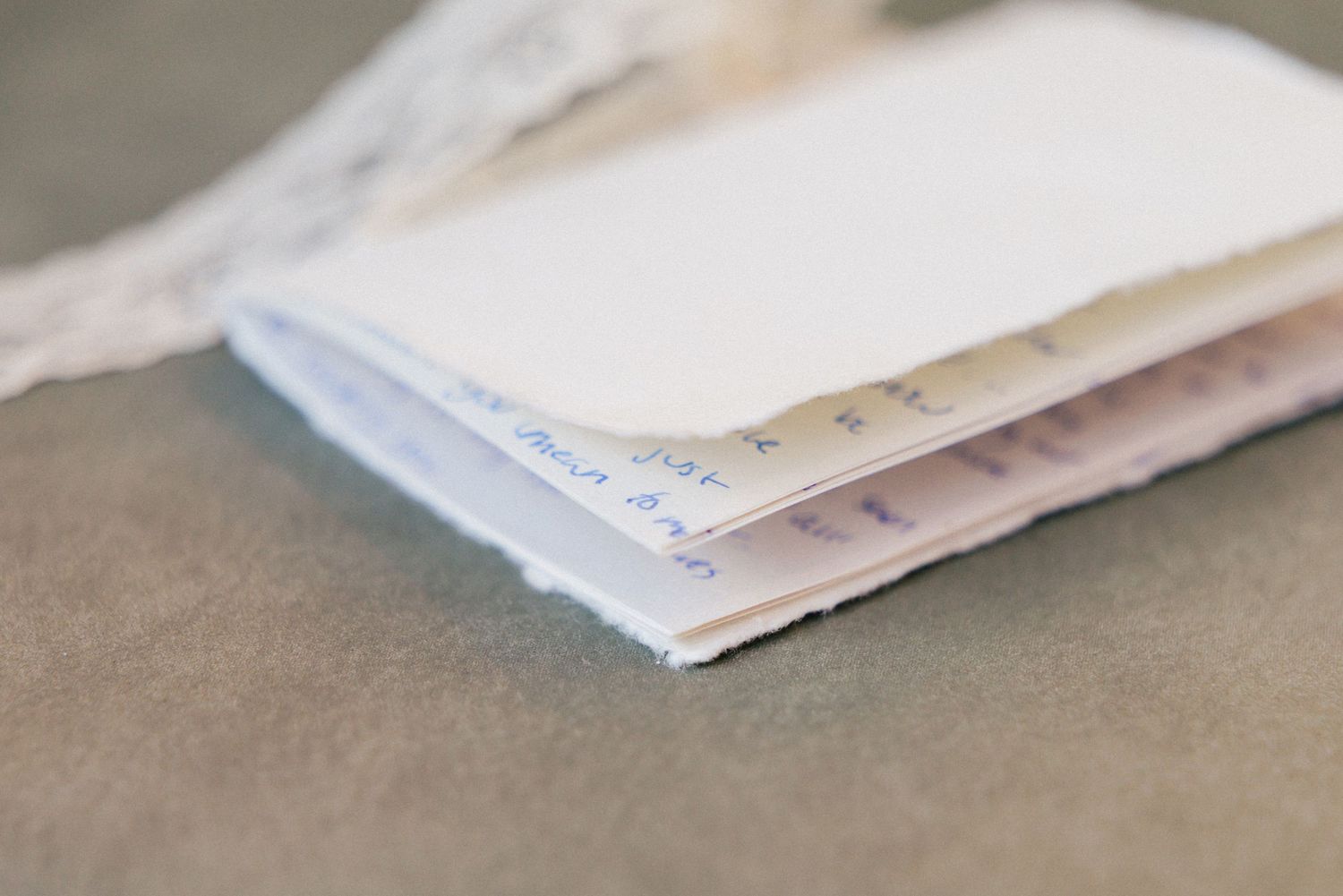Close-up detail of wedding stationery and paper goods.
