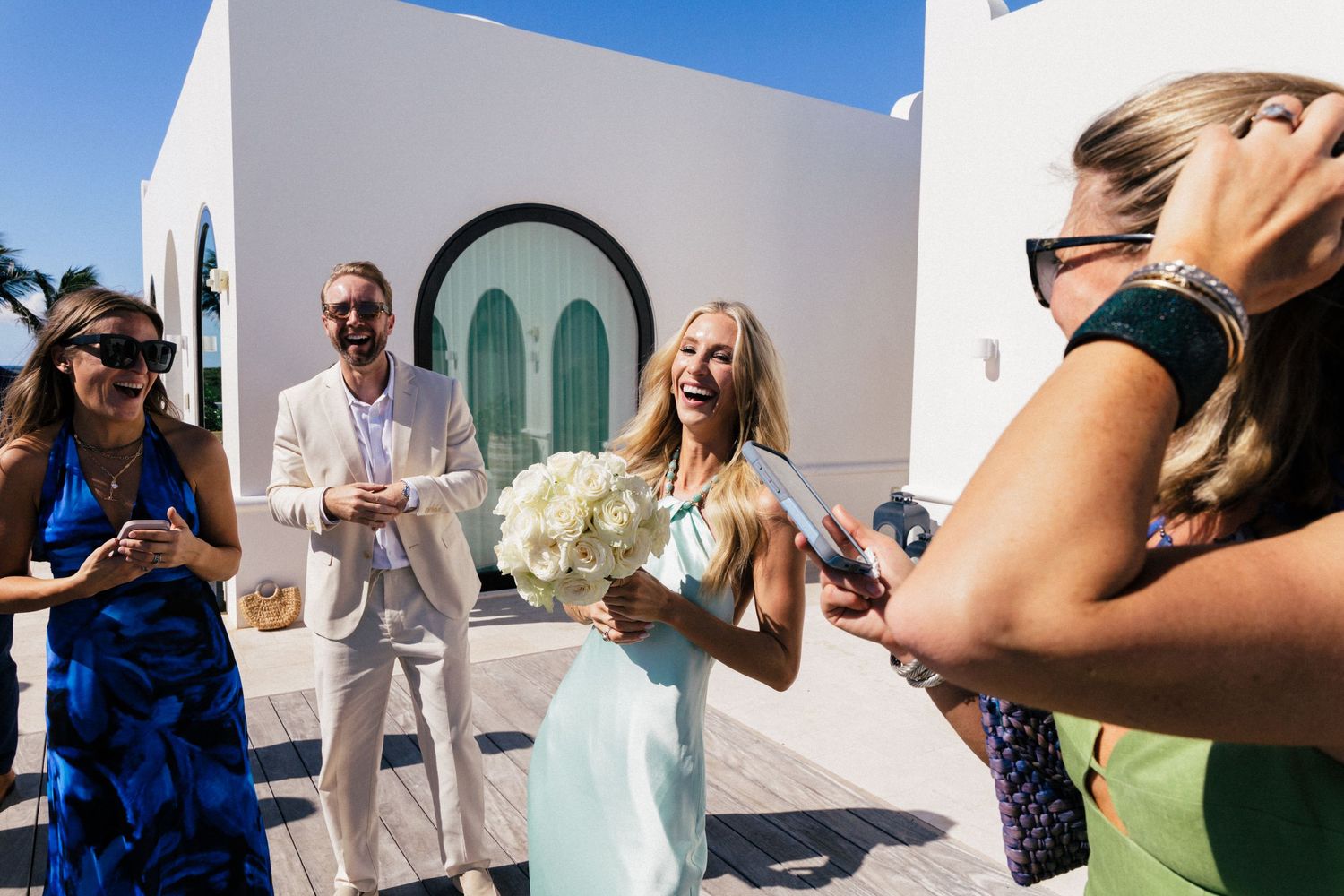 Candid moments captured during a Mediterranean-style wedding celebration.