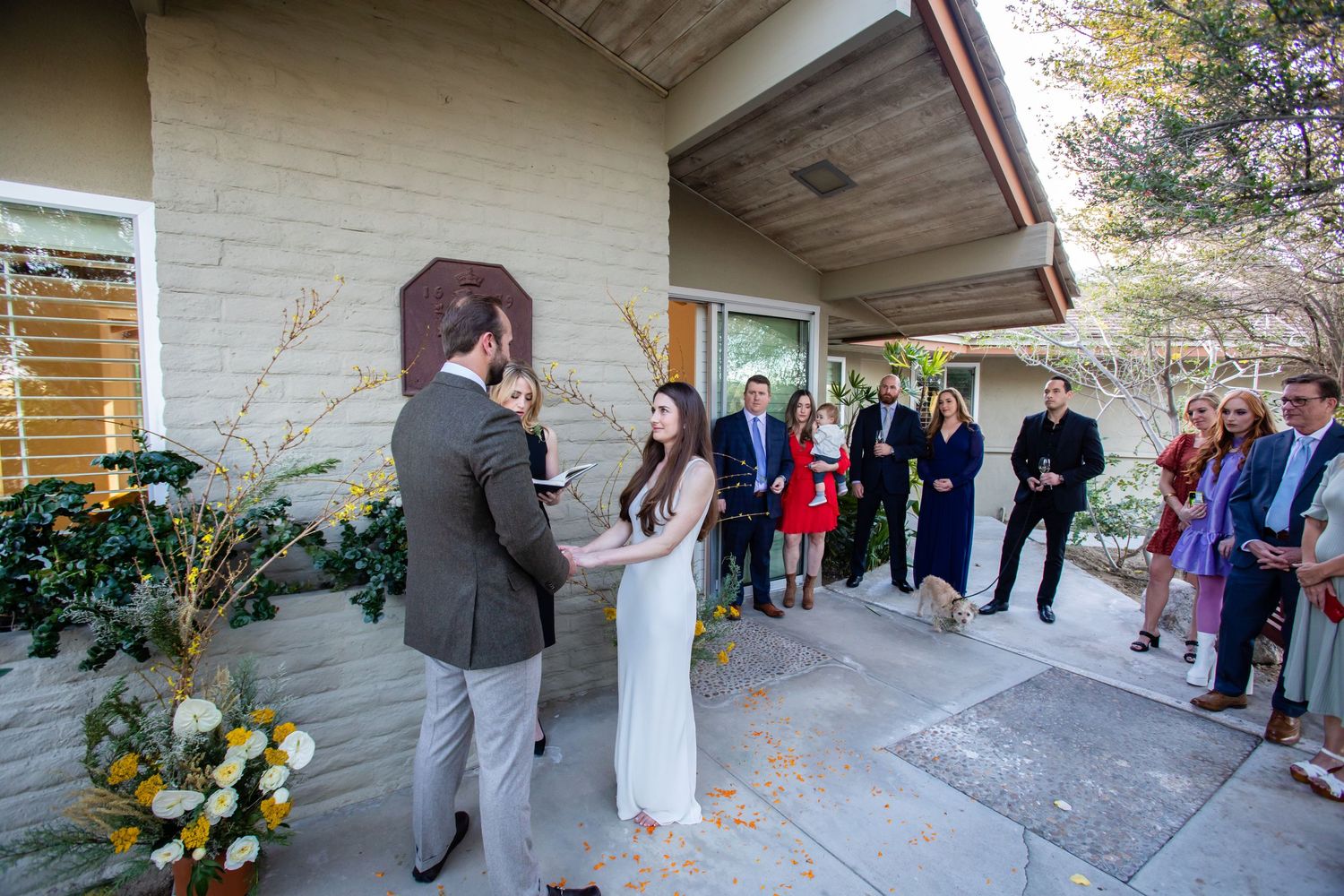 Group of people standing outside a modern building during an event.