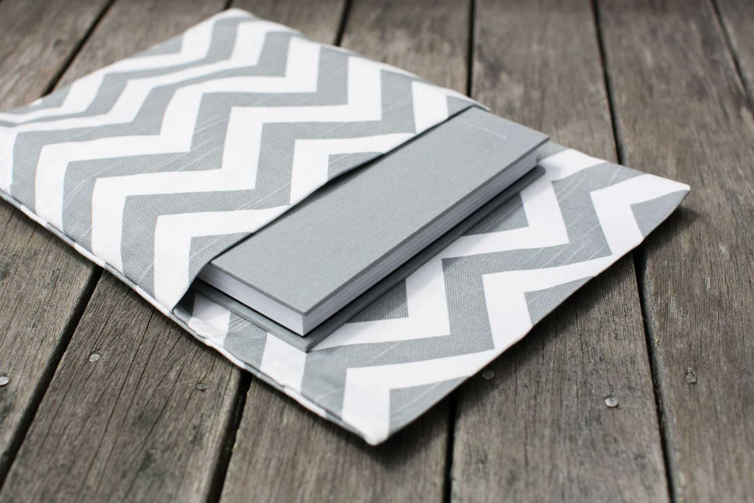 Gray and white chevron pattern fabric sleeve with album insert.