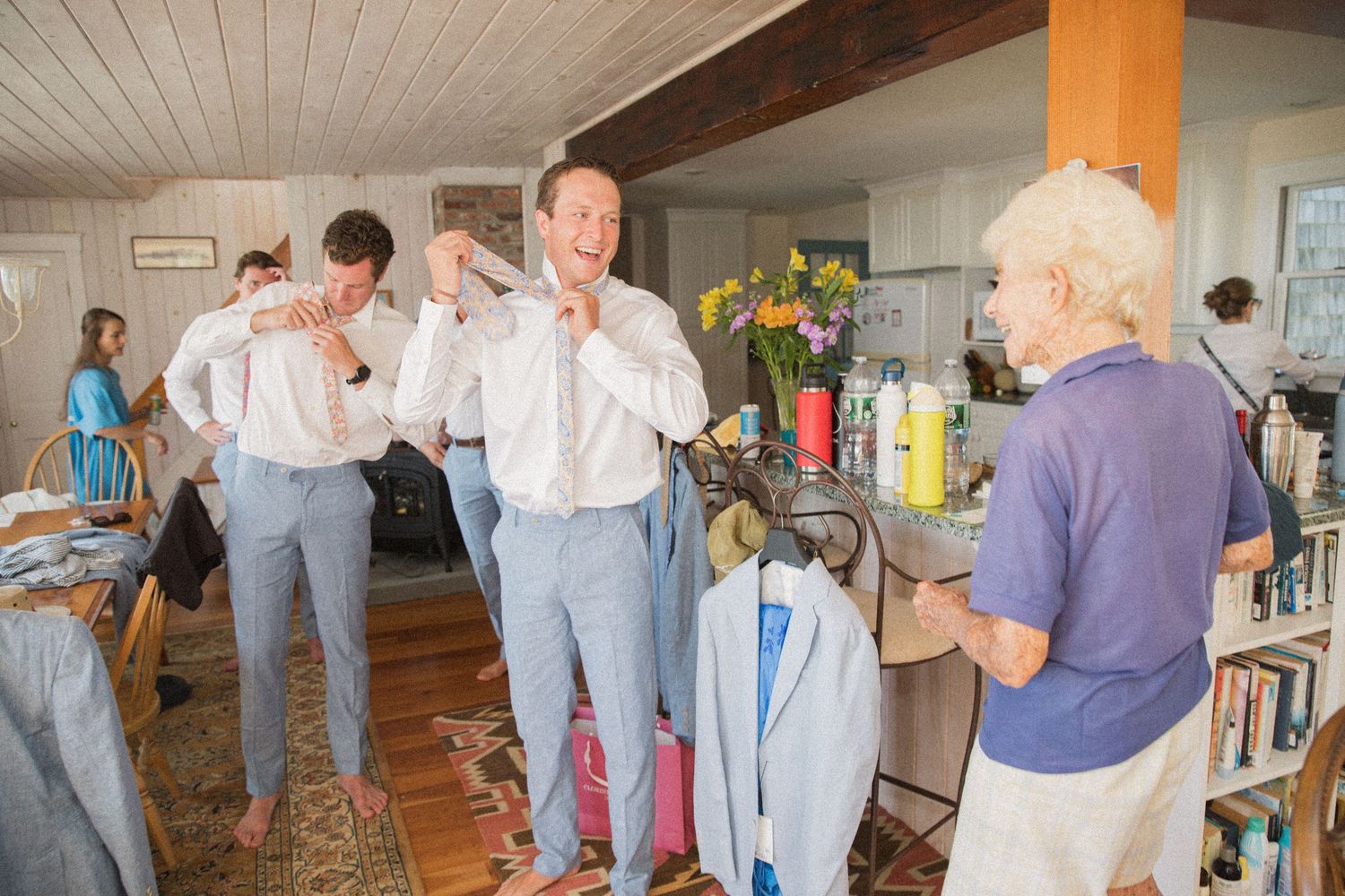 Wedding preparation scene with formal attire and casual indoor setting.