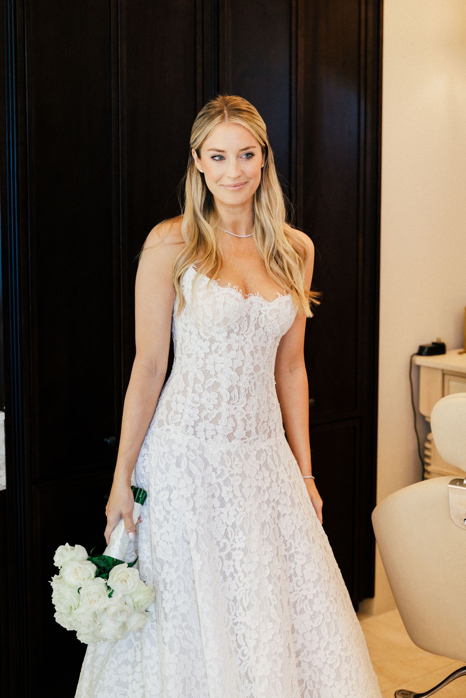Series of photos showing bride in white lace dress against dark doors holding a bouquet.