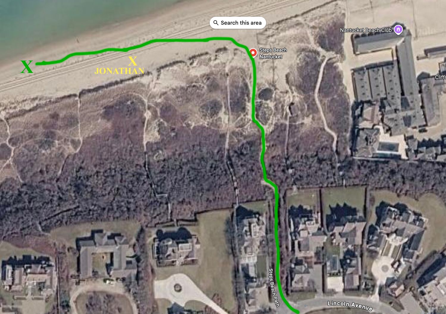Aerial satellite map view of a coastal area with a green route marked, X markers labeled Jonathan on a sandy beach.