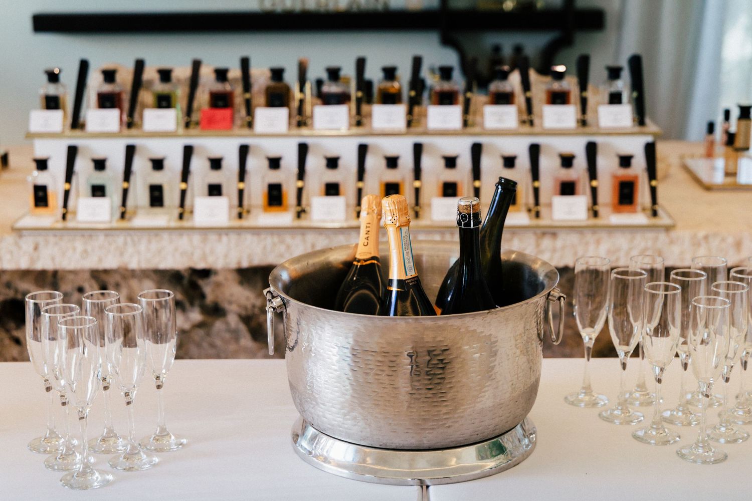 Rows of champagne glasses set up on a bar for an elegant wedding reception.