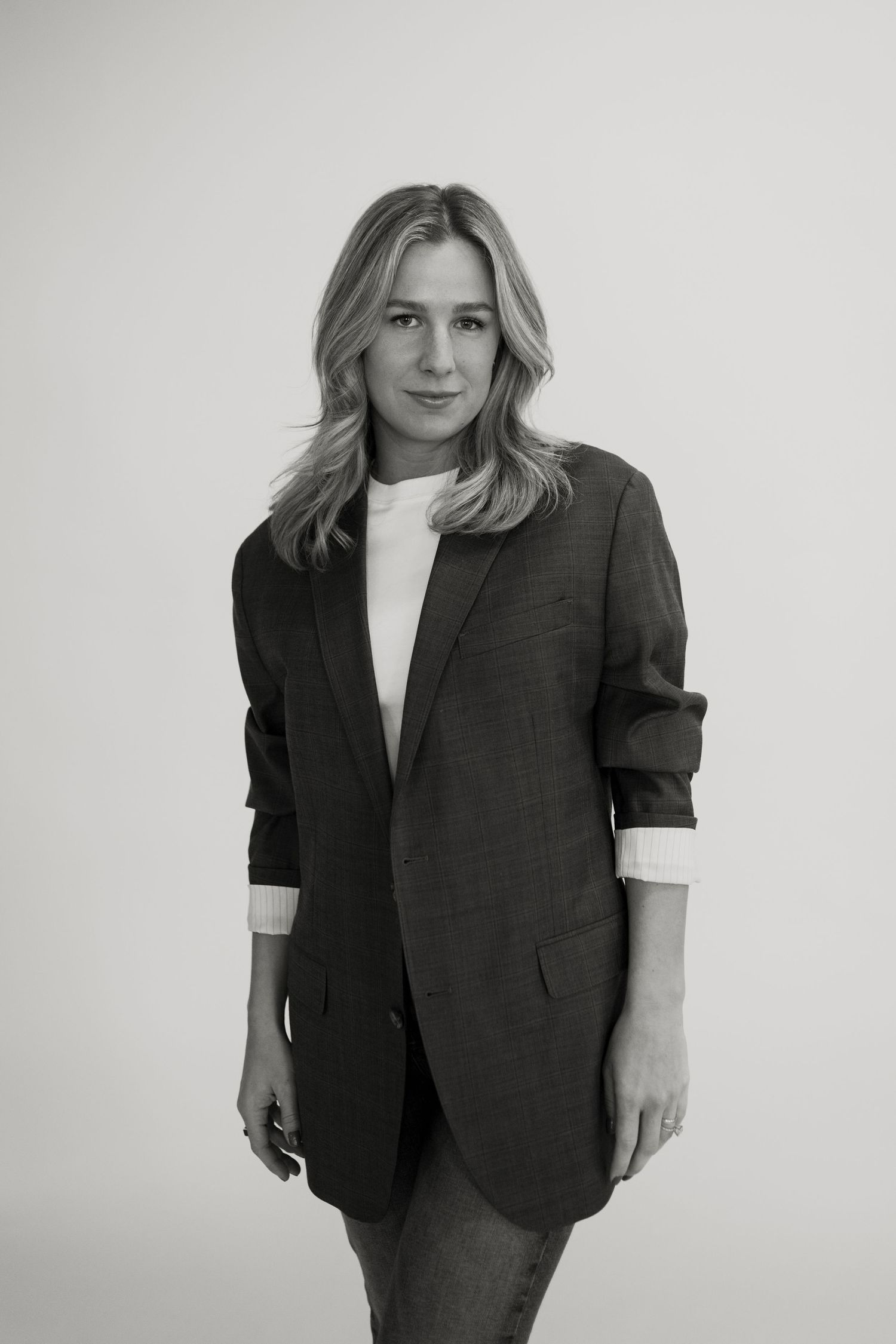 Black and white portrait featuring oversized blazer and white top.