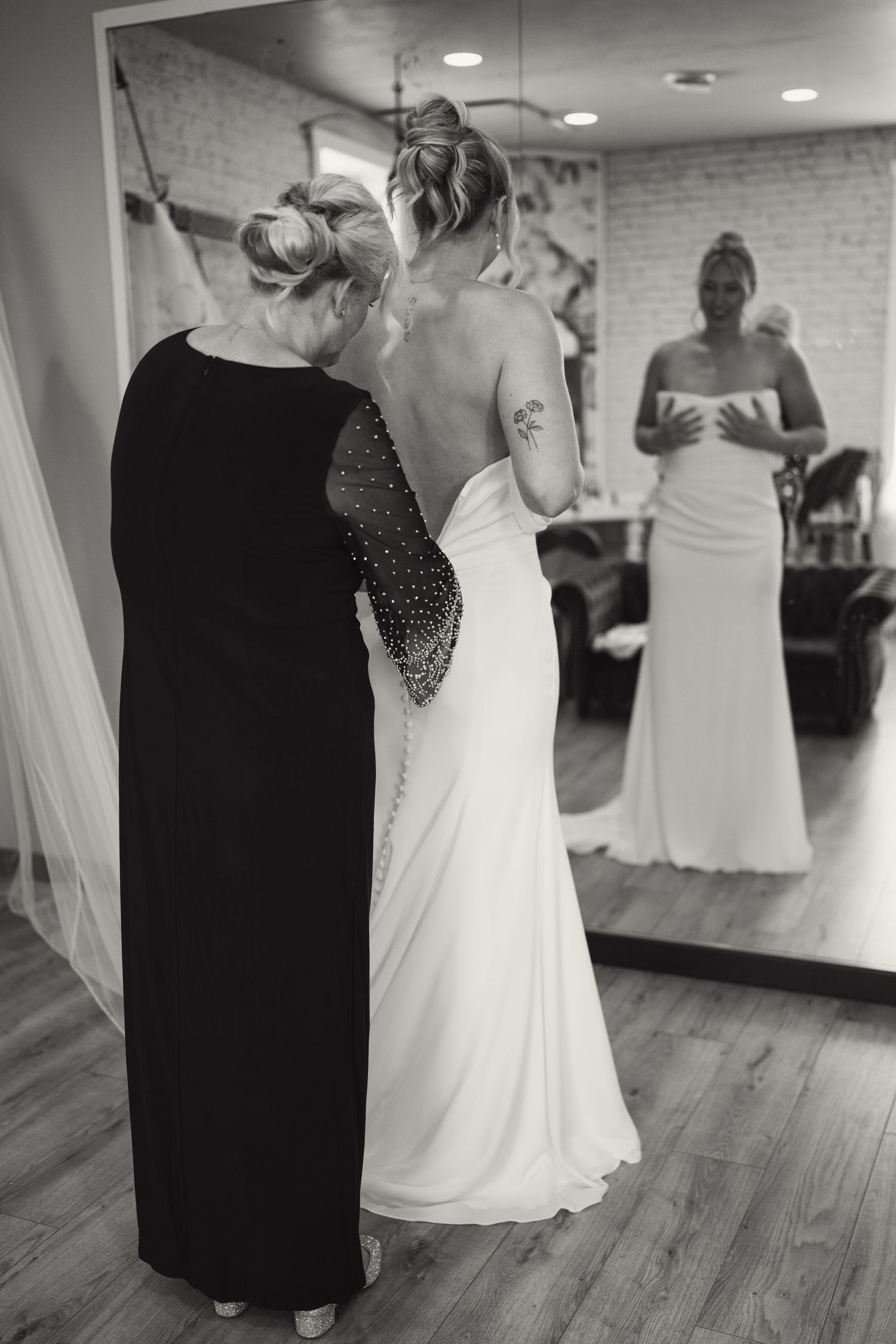 Dance studio with mirrors showing wedding dress fittings and preparations.