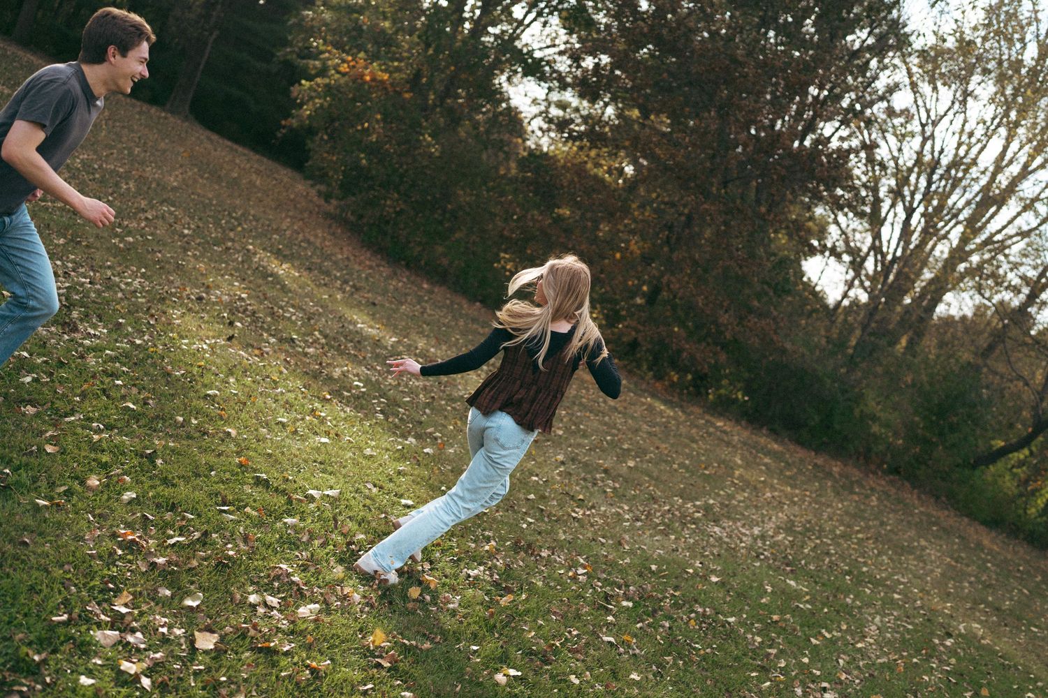 Dynamic action shots of two people playing and jumping in a park setting.