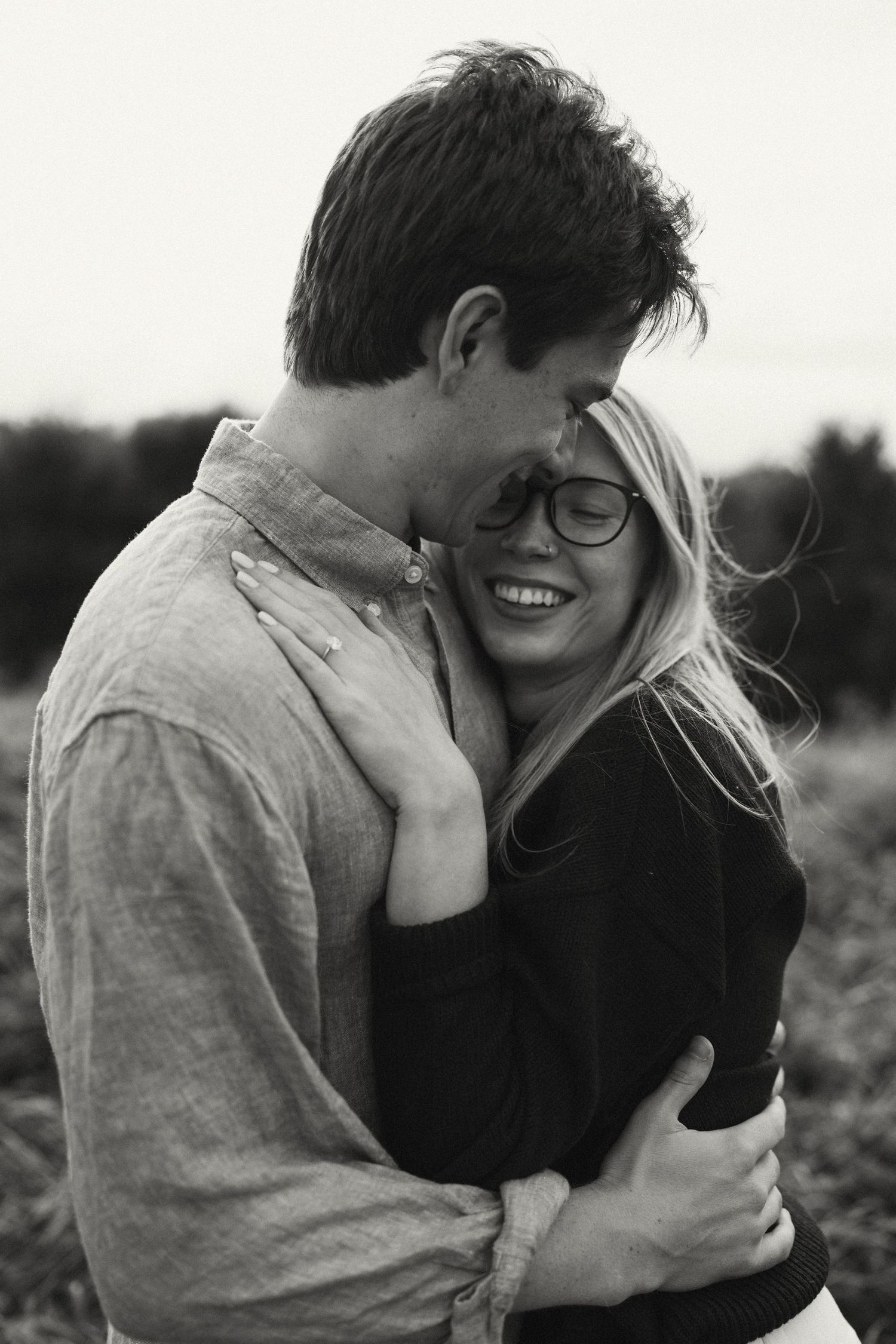An intimate black and white photo sequence showing a close embrace.