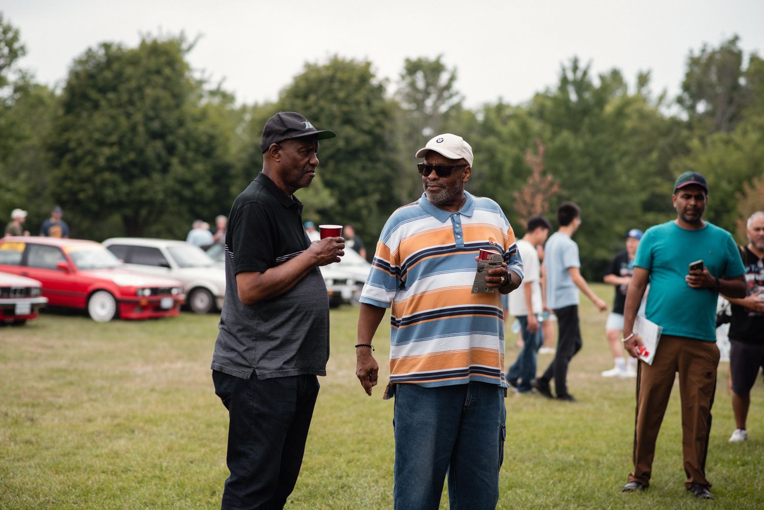 BMW enthusiasts chatting during the TedFest classic car gathering.
