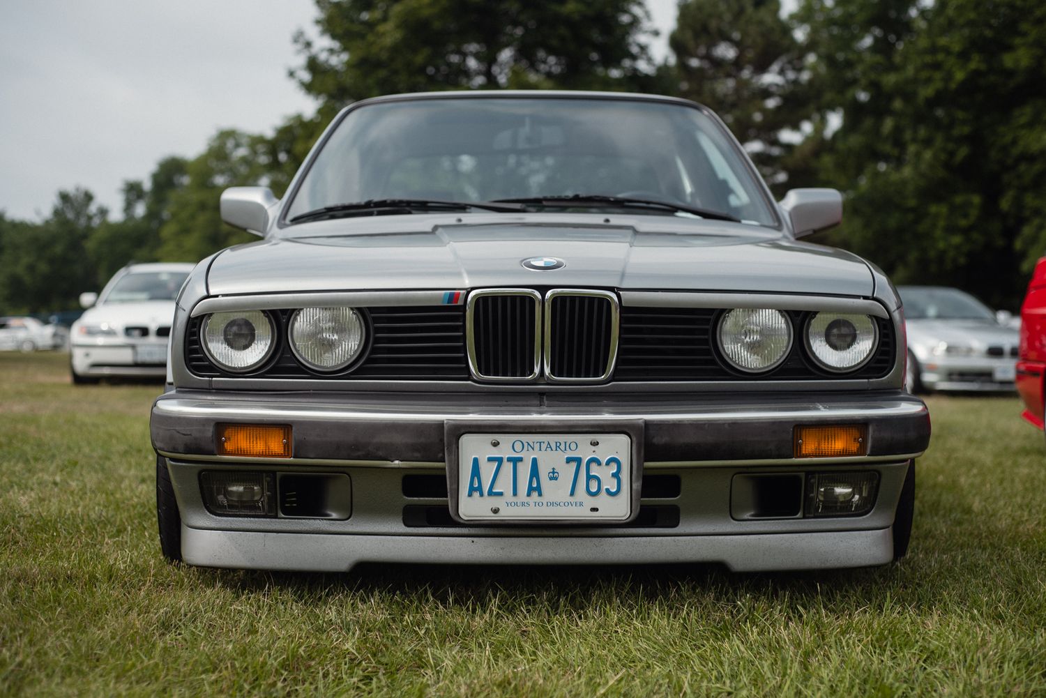 Front view of a classic BMW E30 displayed at TedFest in Niagara.