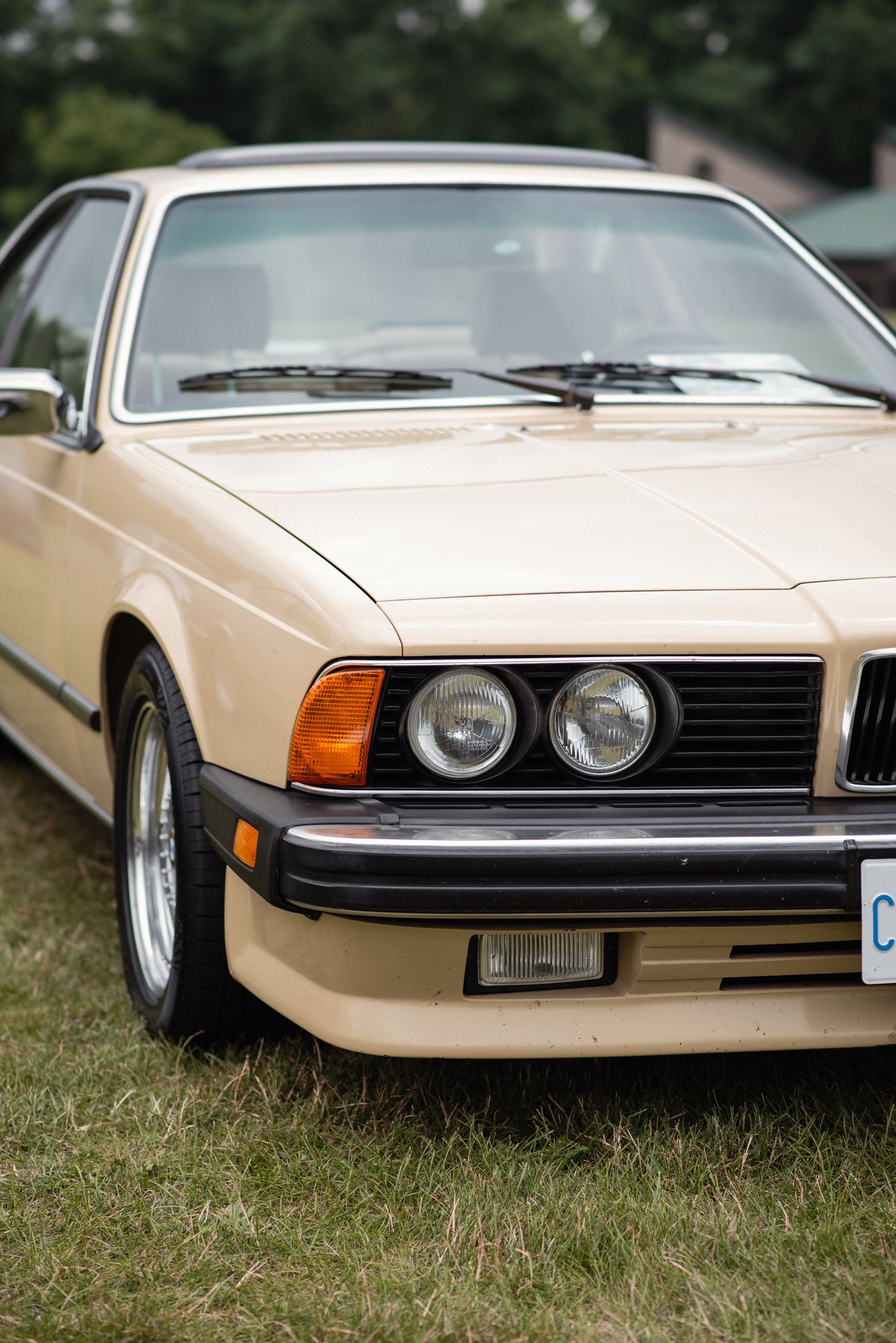 Front view of a vintage cream BMW displayed at TedFest in Niagara.