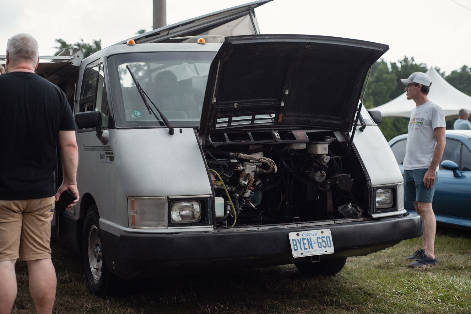 Vintage BMW support van with its hood open at TedFest.