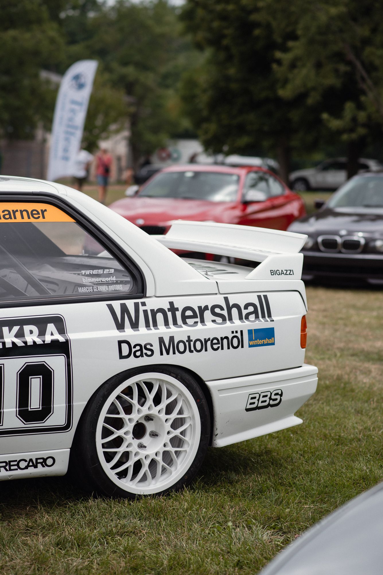 BMW E30 race car featuring period racing livery on display at TedFest.