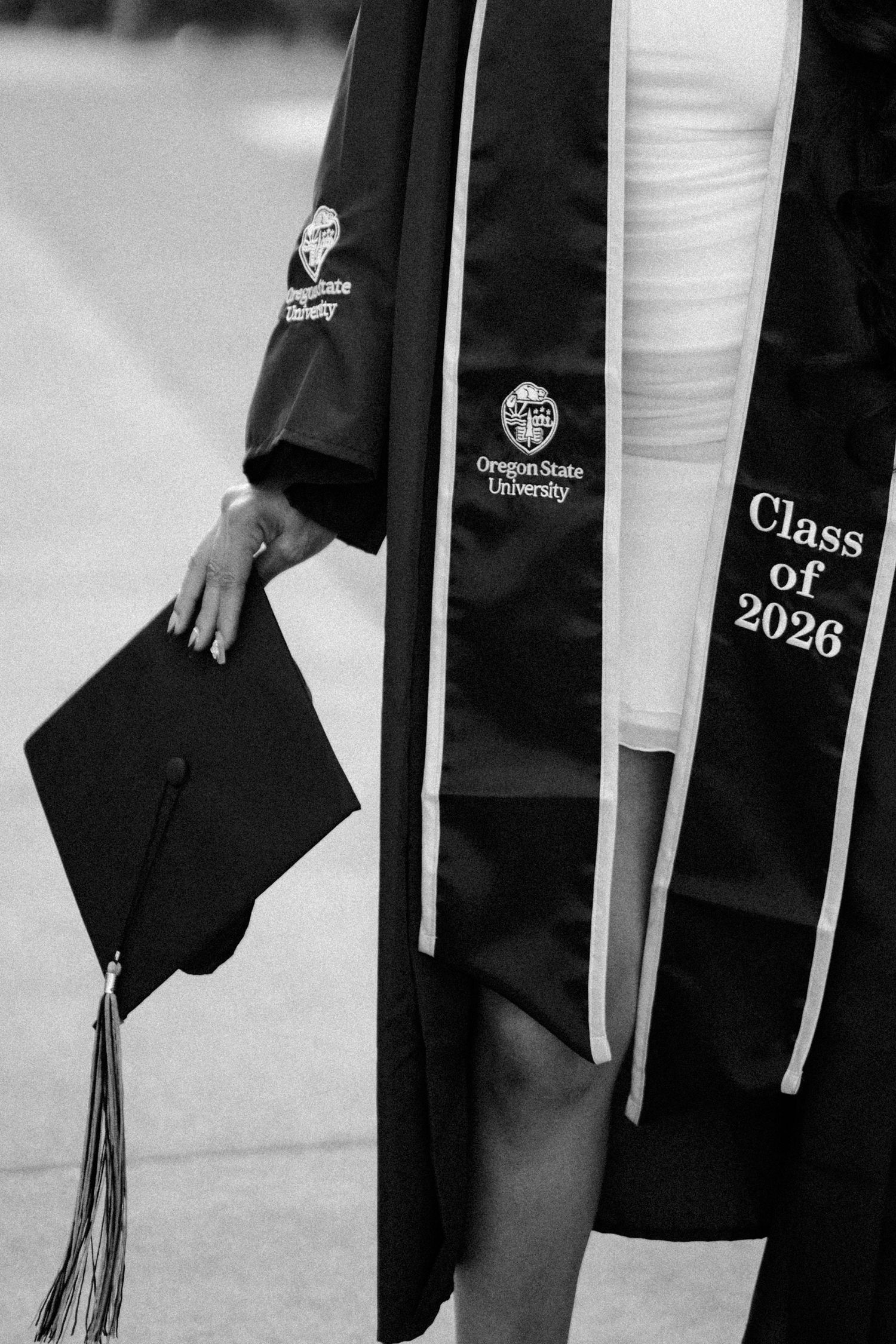 Black and white photo of Oregon State University Class of 2026 graduation regalia with mortarboard cap.
