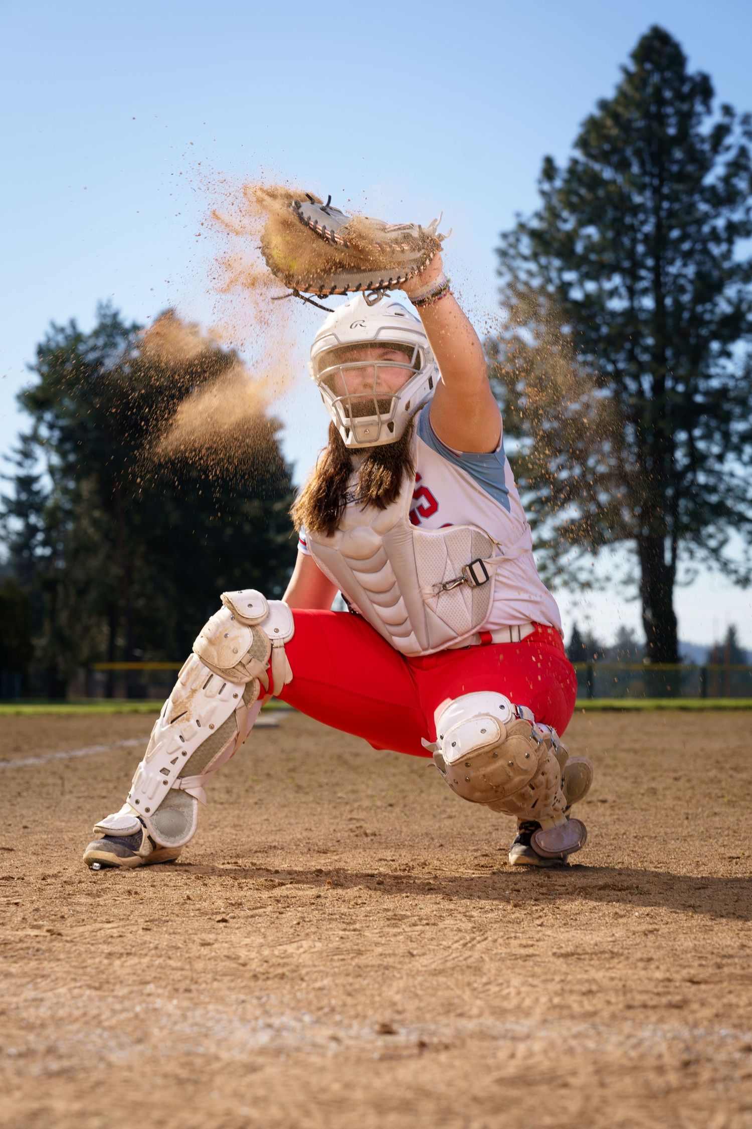 Baseball player sliding into base on dirt infield in dramatic action sequence showing multiple motion frames.