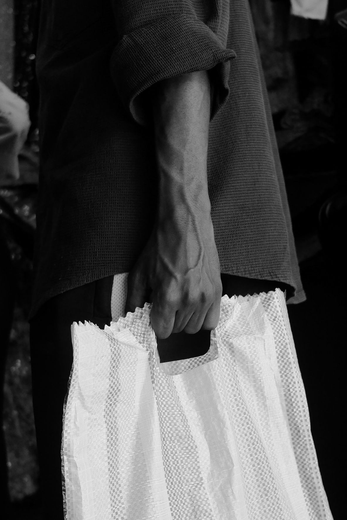 Black and white detail of dress with white lace trim.