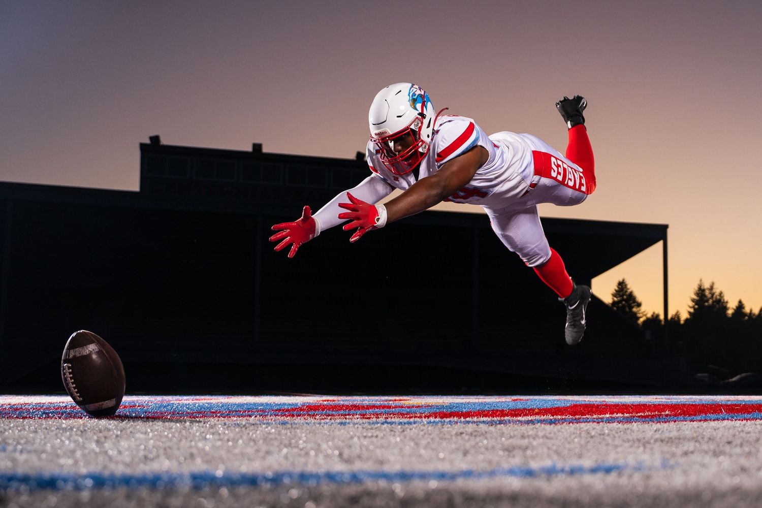 Dynamic action shots of football players diving across field at sunset.