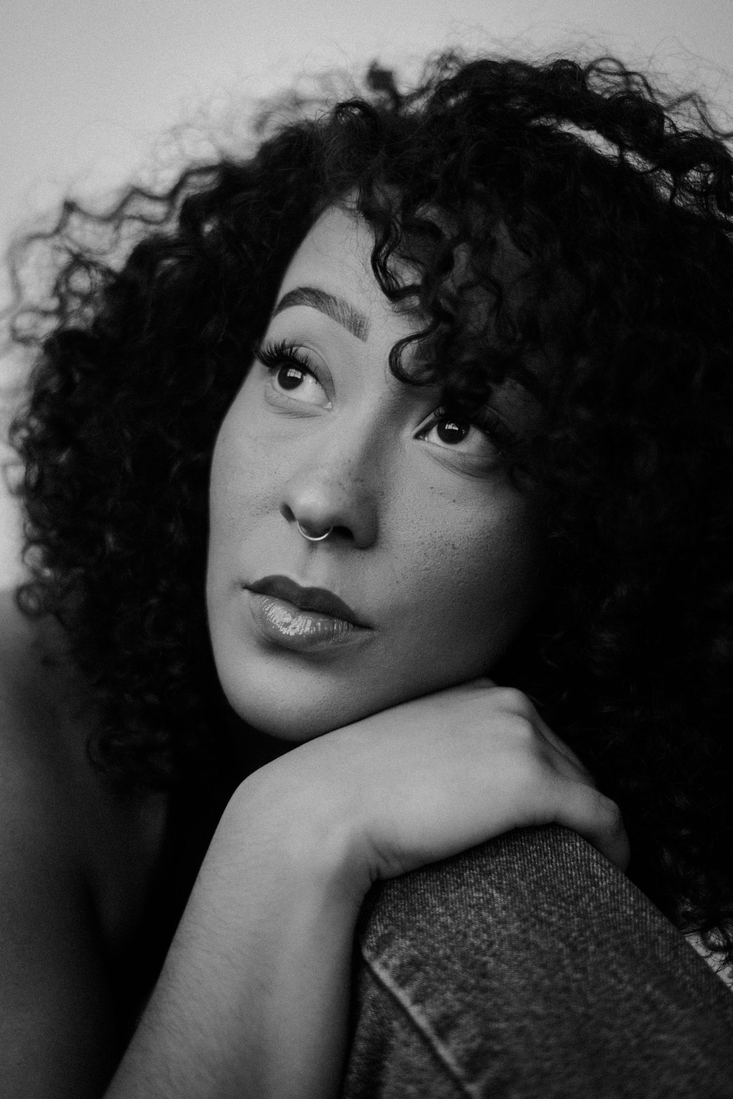Black and white close-up portraits with dramatic lighting and expressions.