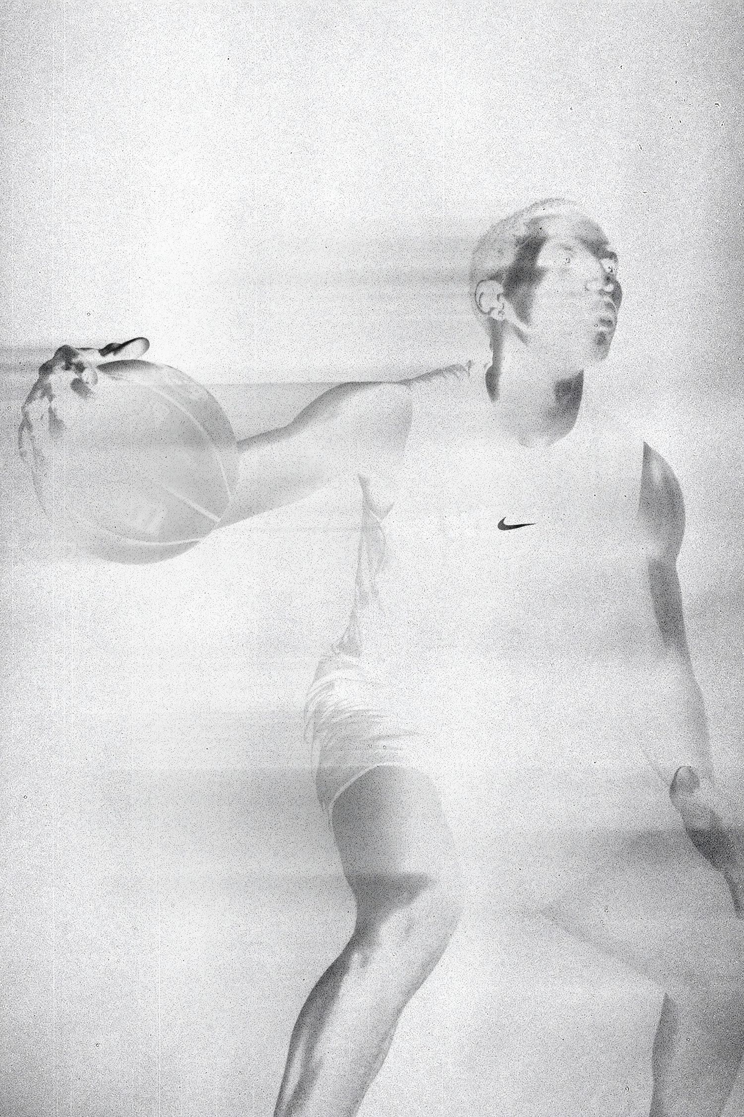 High key basketball portrait showing athlete with ball in ethereal style.
