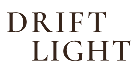 Drift Light brand logo displayed in dark brown serif typography on a white background.