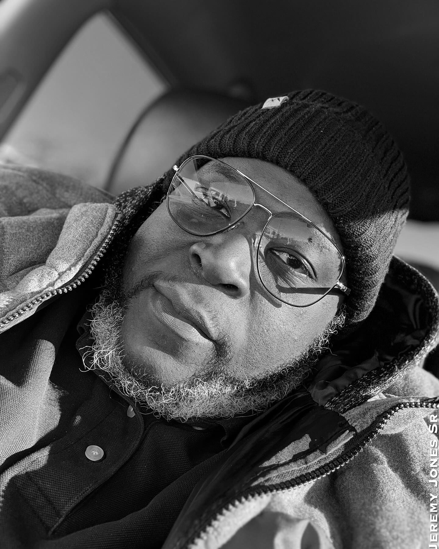 Black and white portrait series showing person relaxing in casual setting.