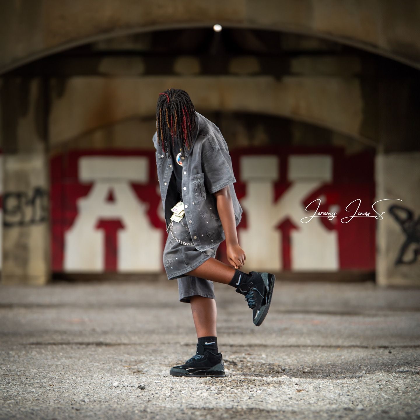 Dynamic low-angle shot of shoes in motion against concrete ground.