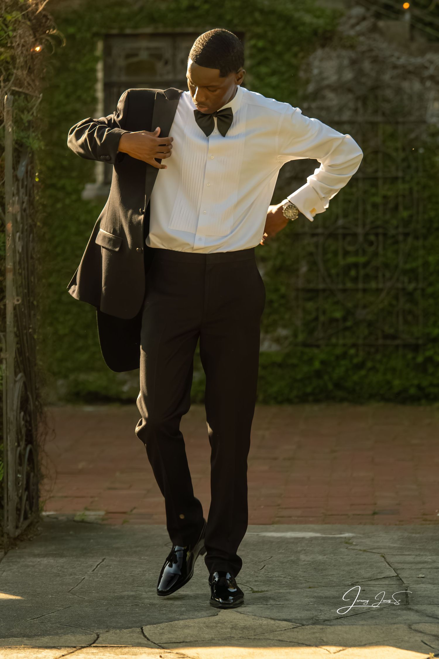Formal black and white attire detail shots focusing on dress shoes and pant legs.