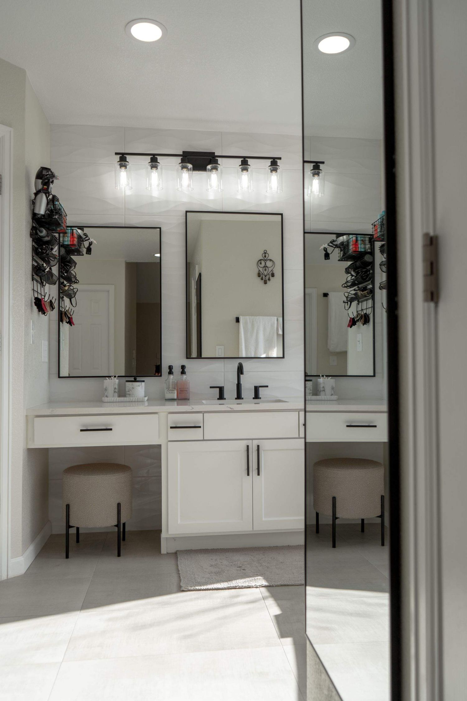 Modern bathroom with a double vanity and large mirrors, photographed for Denver, Colorado, real estate and interior design photography.