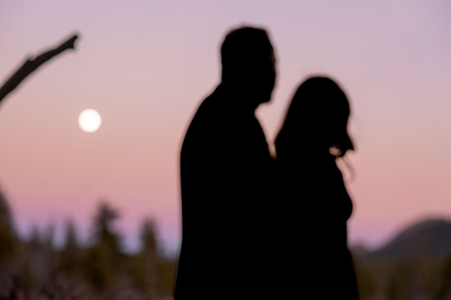 Silhouette couple portrait at sunset during a romantic outdoor engagement photography session captured by a Colorado photographer.