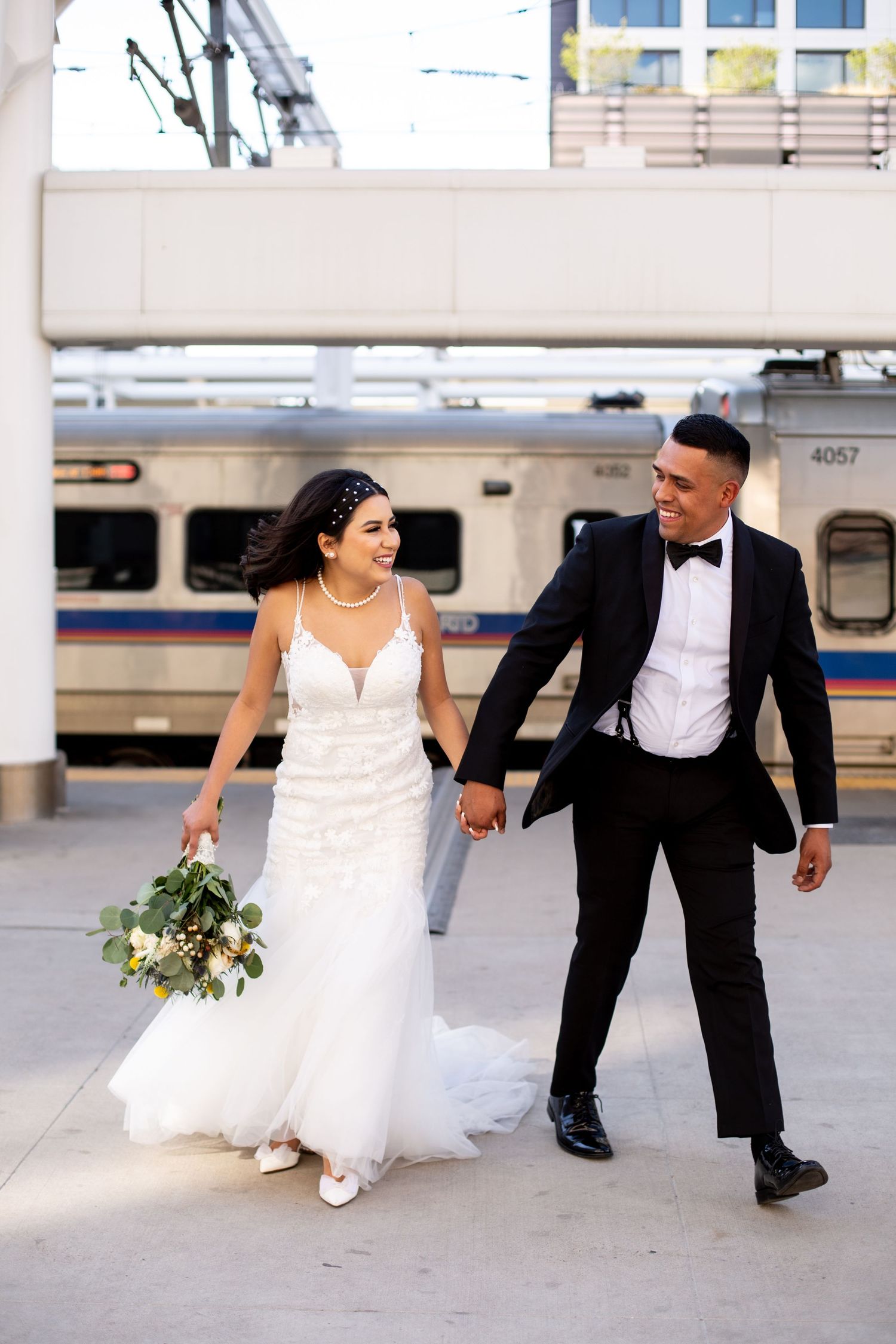Bride and groom walking together after their ceremony during a modern wedding photography session captured by Colorado wedding photographer