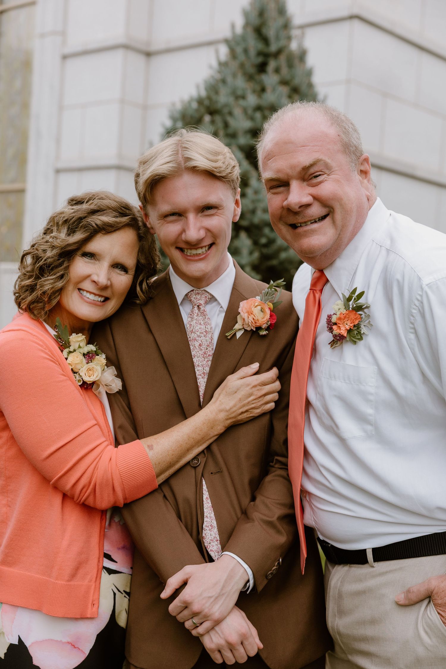 A series of candid photos showing people in coral and brown attire laughing and embracing outdoors.