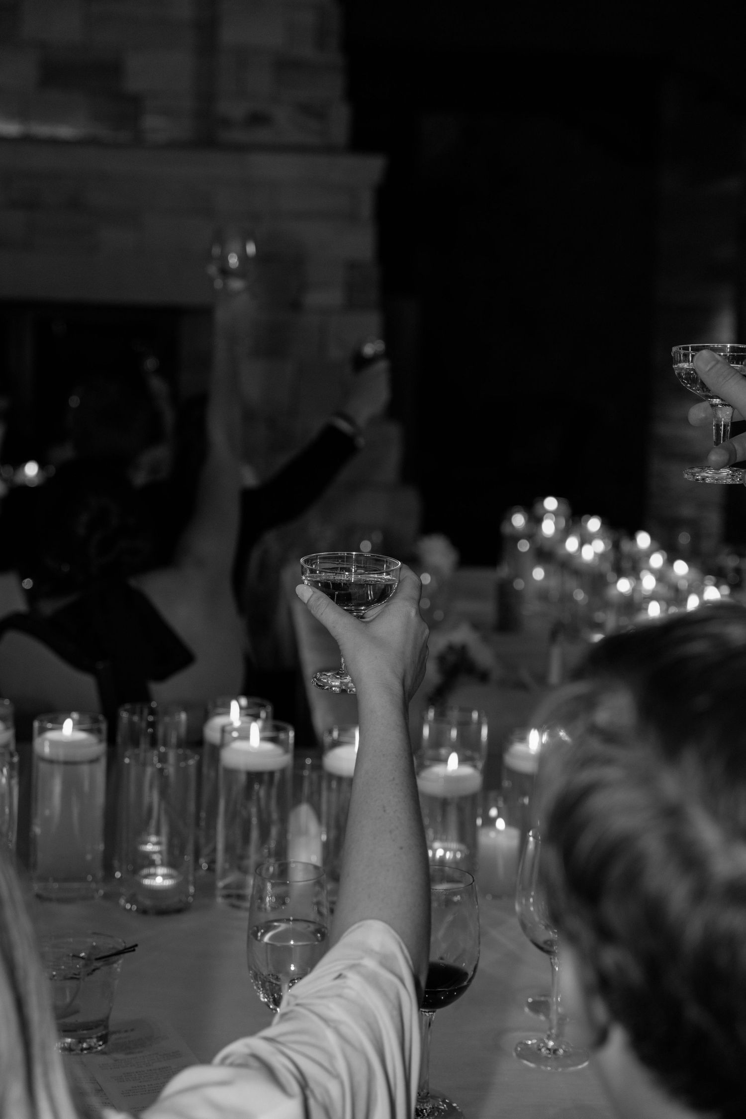 Candlelit tables at an evening reception with glowing ambiance.