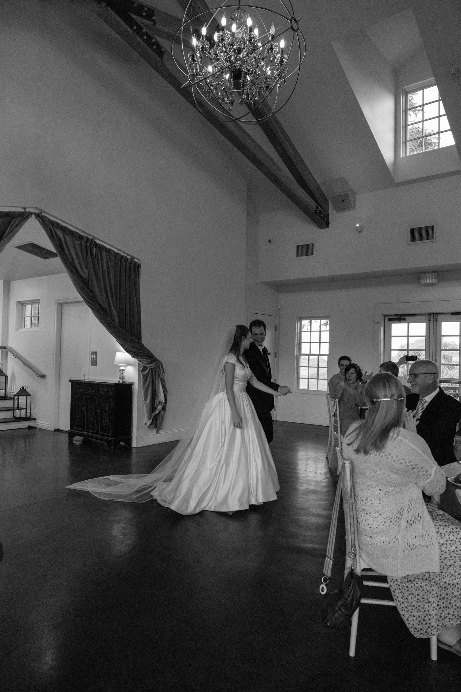 Black and white photos capturing moments during a wedding reception.