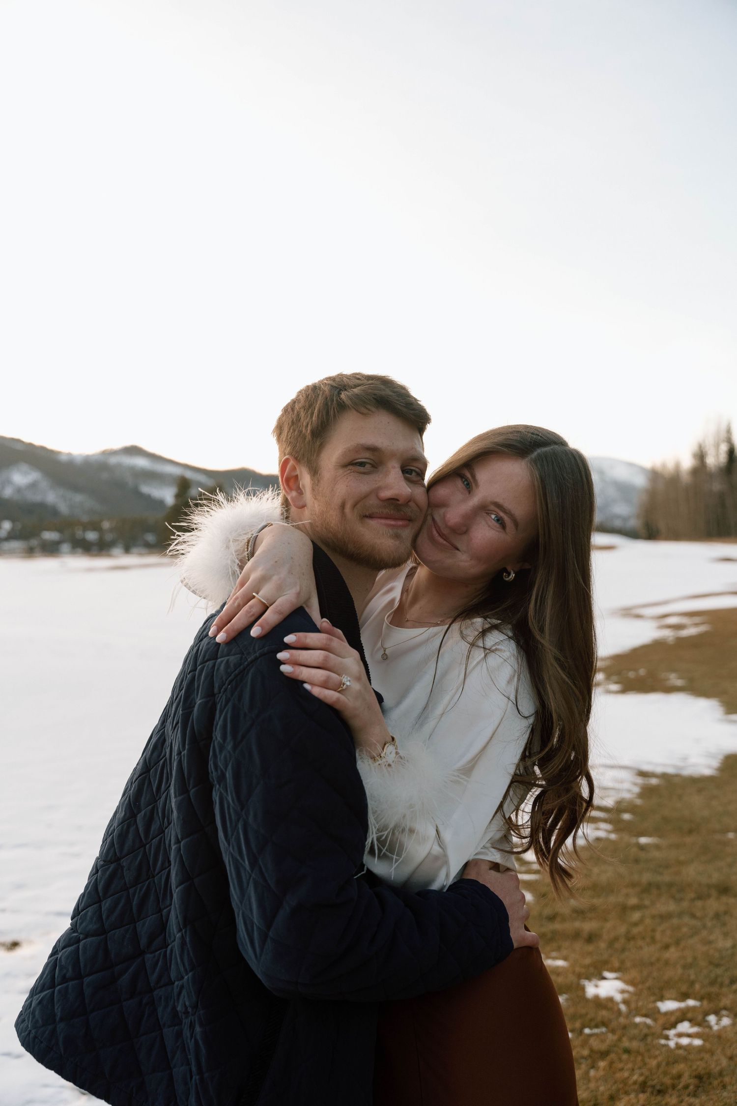 Sweet candid moments between a couple during their mountain engagement photoshoot.