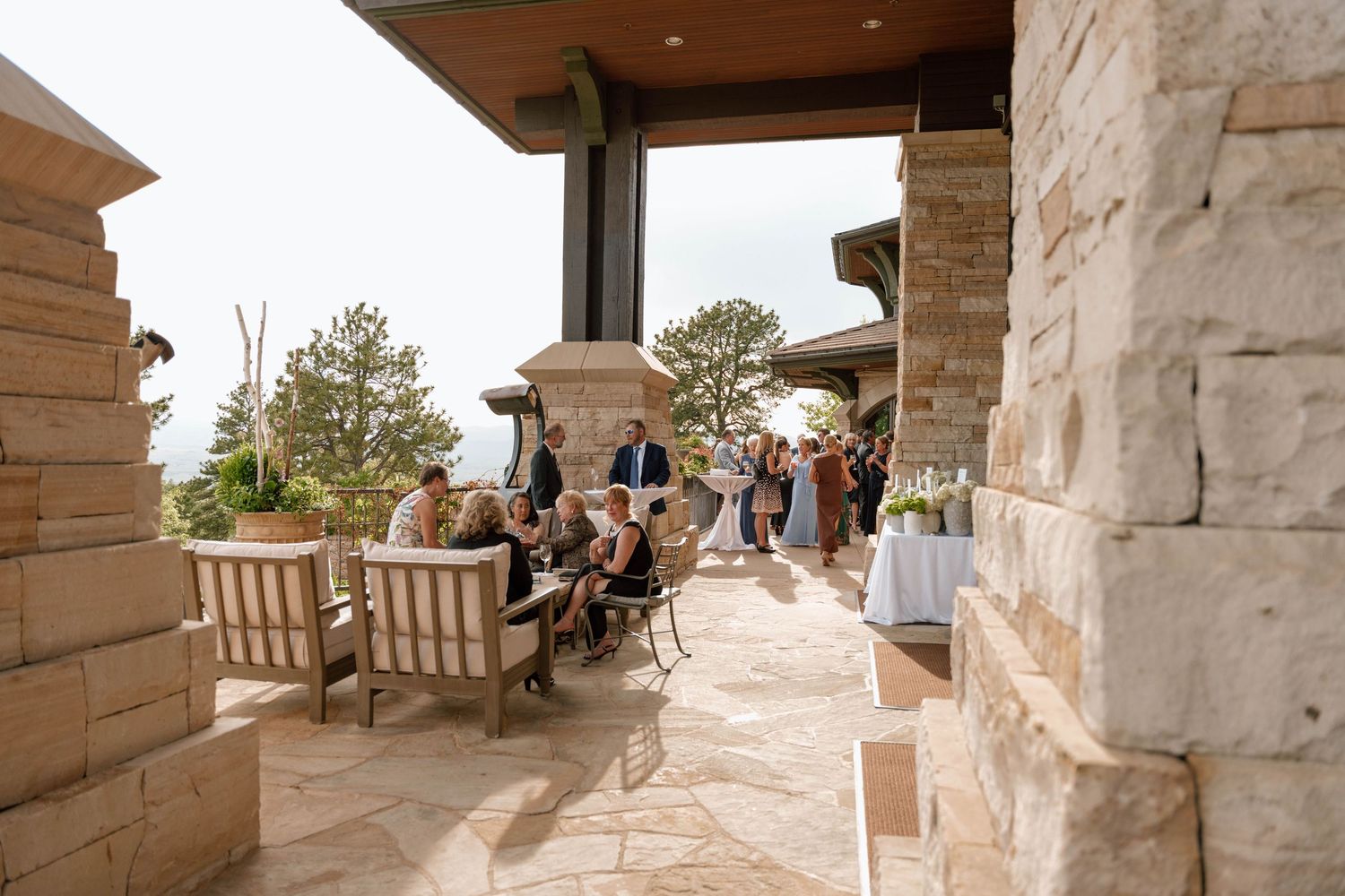 Stone terrace with panoramic mountain views at an upscale event venue.