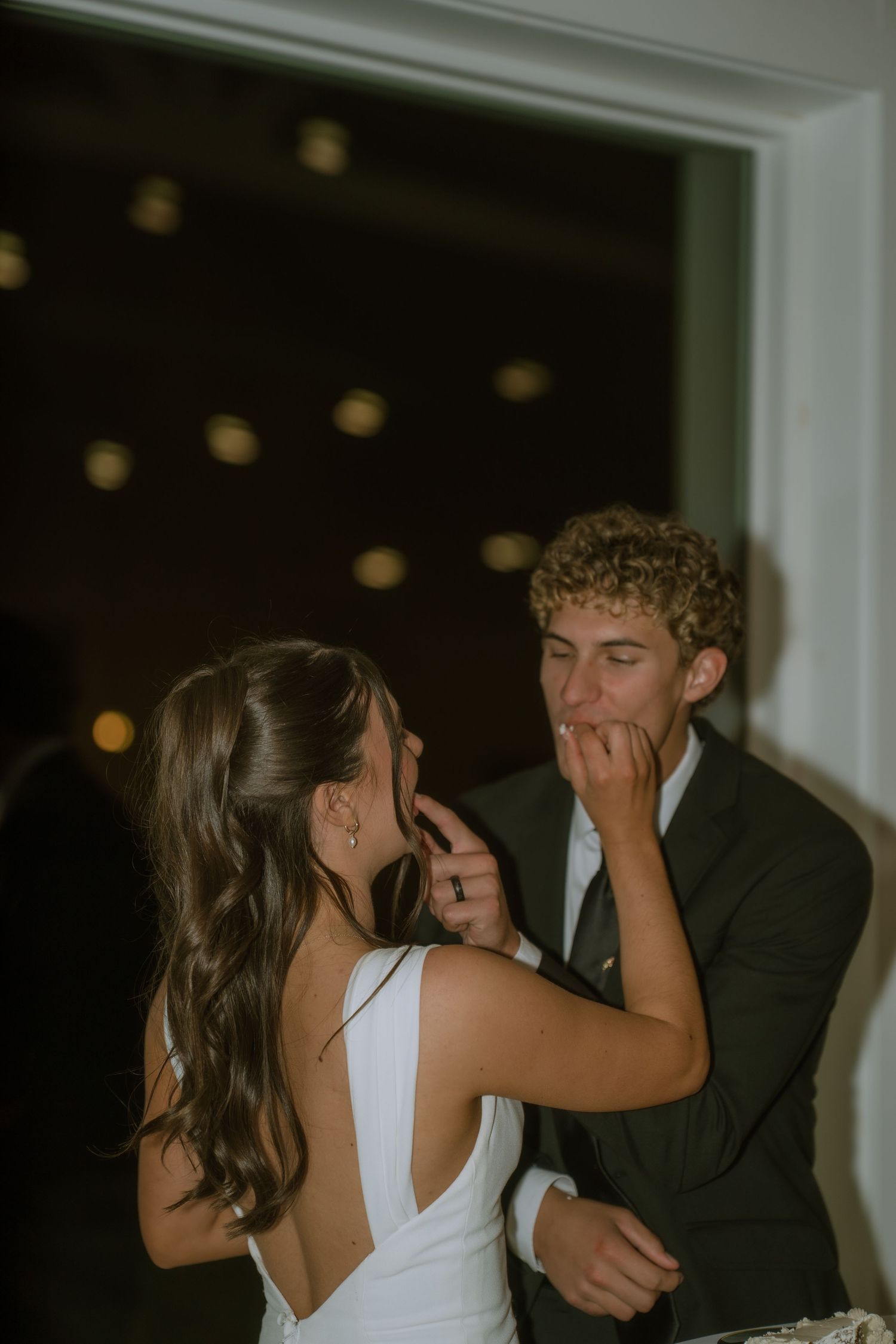 Intimate dance moment captured during a dimly lit wedding reception.