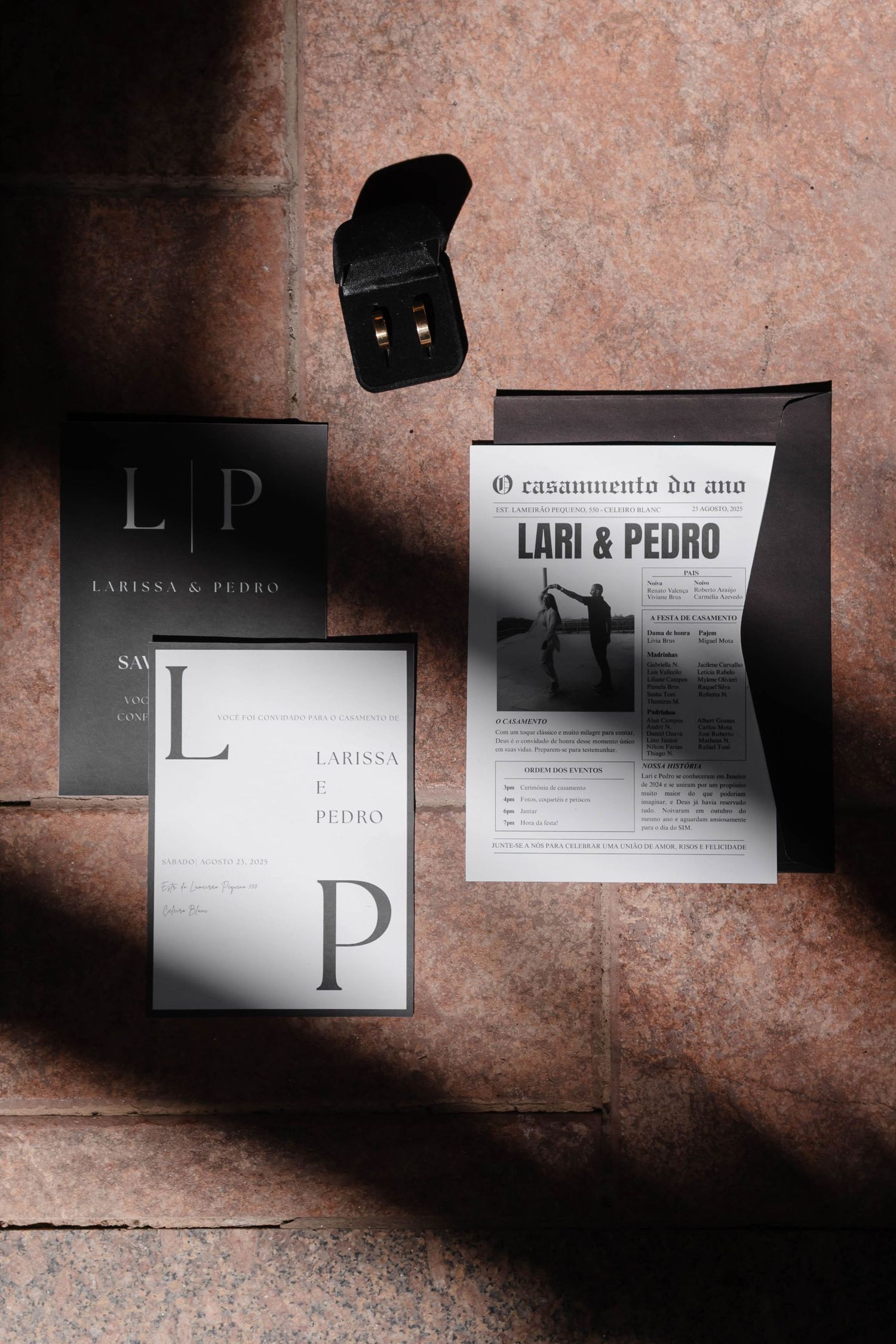 A collection of minimalist black and white business cards with modern typography displayed on a textured pink surface.