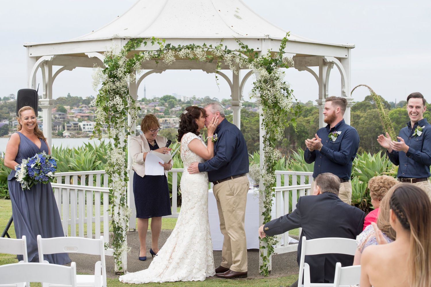 A collage of outdoor wedding ceremony photos showing a beachfront gazebo and guests gathered for the celebration.