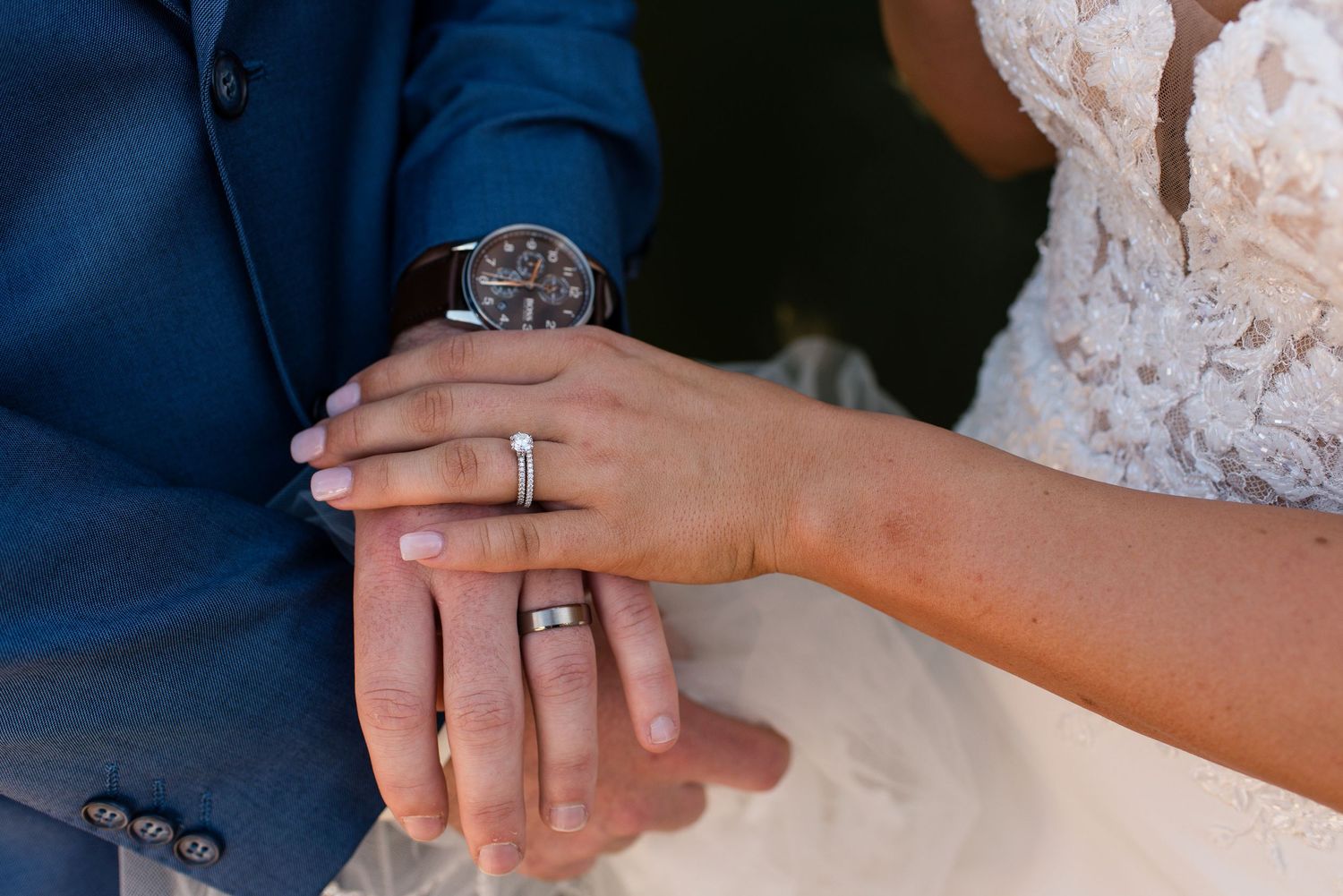 Close-up shots of wedding rings and hands during ceremony.