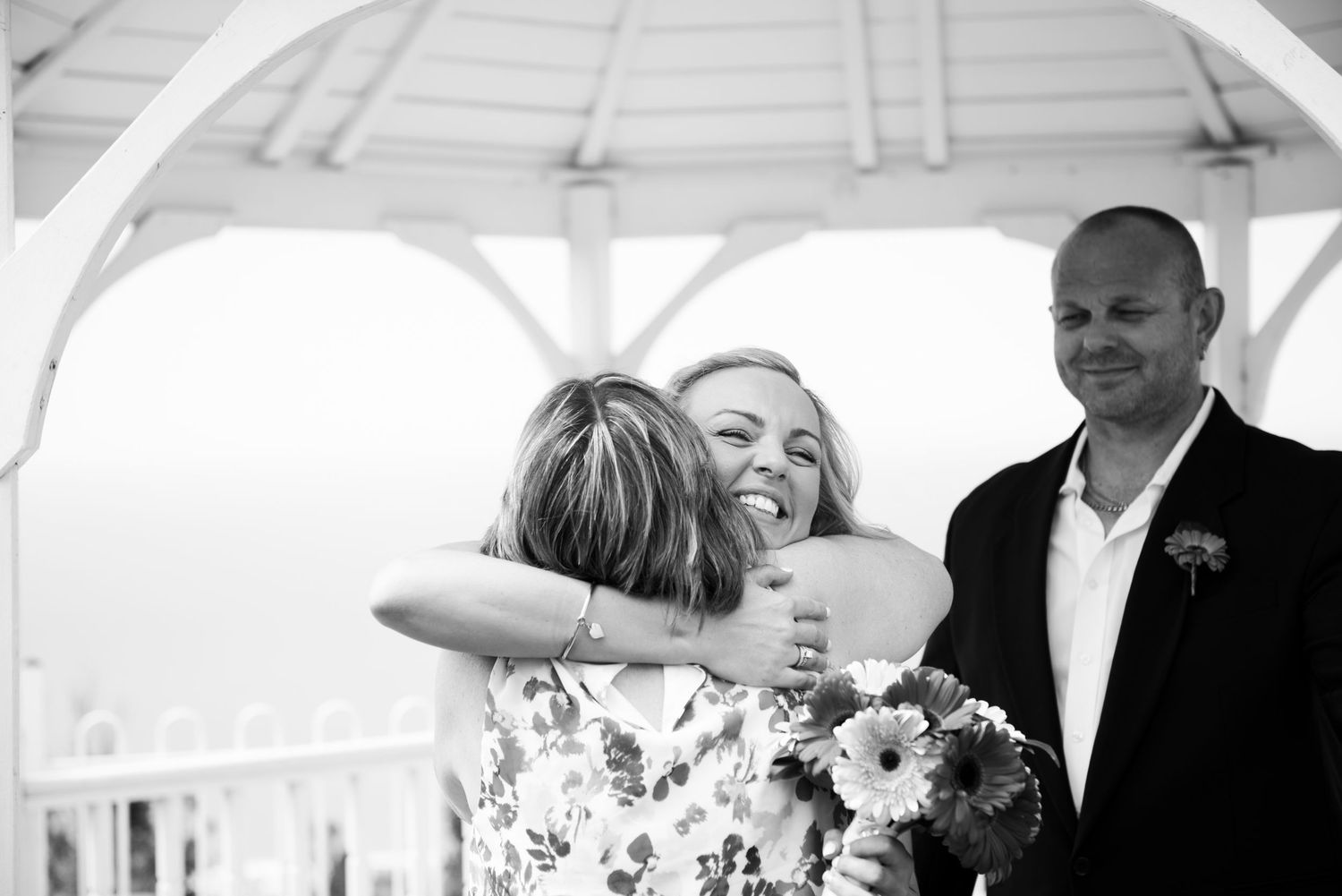 Bride being congratulated by guest at Panorama House.