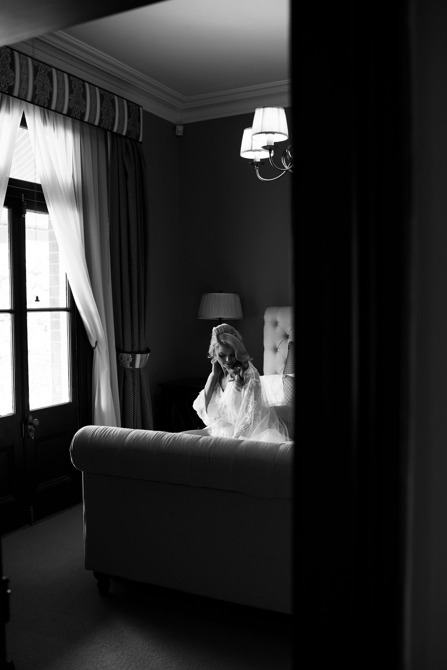 Dramatic black and white photo series showing silhouettes against bright windows in a dark moody room.