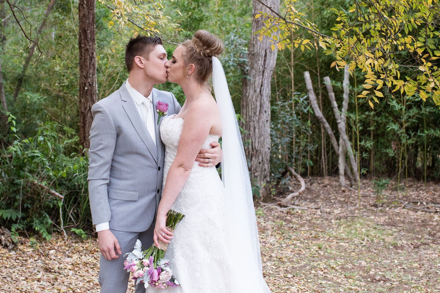 Bride and Groom shares romantic moments in an outdoor setting.